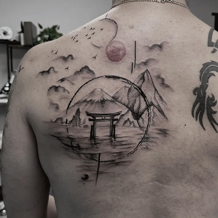 Japanese-style back piece tattoo in black and grey